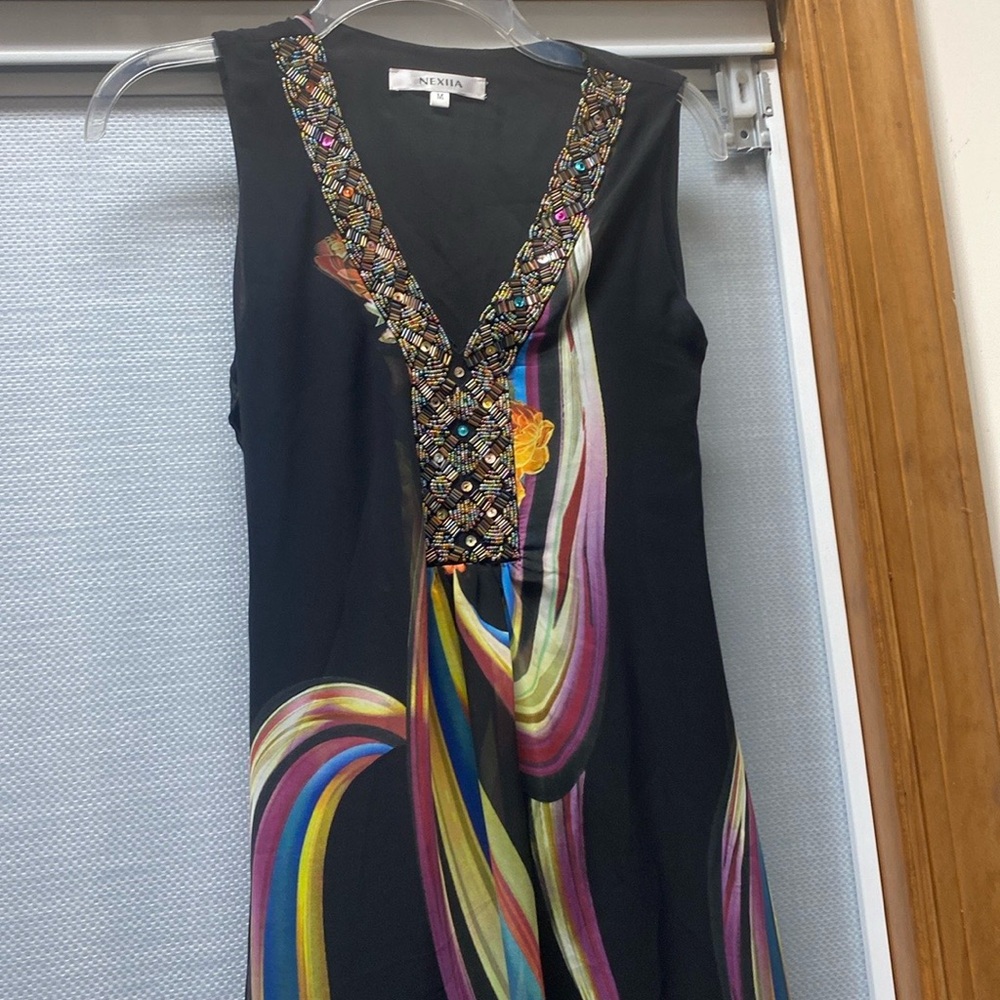 Black sleeveless dress with beaded neckline